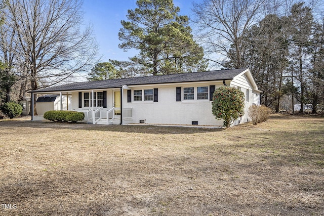 ranch-style house featuring crawl space, a porch, a front lawn, and brick siding