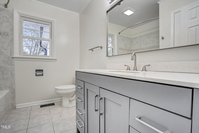 bathroom with toilet, baseboards, vanity, and crown molding