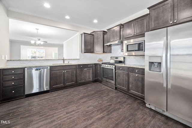 kitchen with stainless steel appliances, dark brown cabinetry, and under cabinet range hood