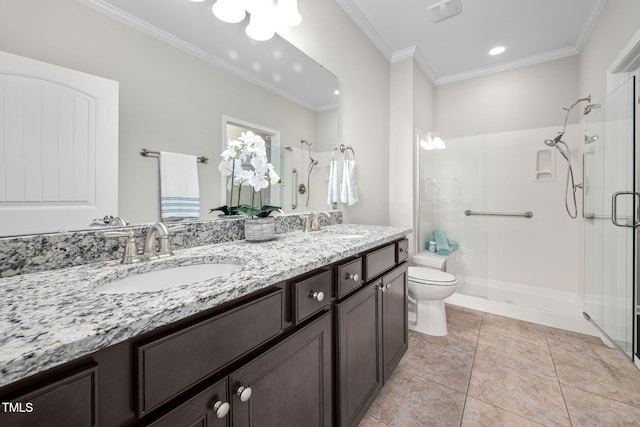 full bath with toilet, a stall shower, crown molding, and a sink