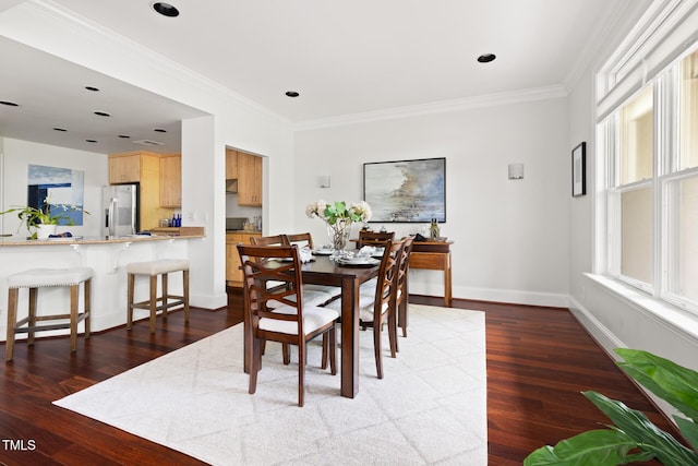 dining room featuring recessed lighting, baseboards, ornamental molding, and wood finished floors