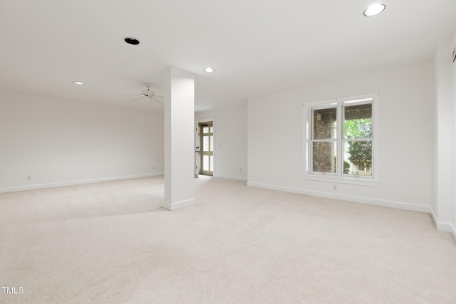 unfurnished room with baseboards, recessed lighting, light colored carpet, and a ceiling fan