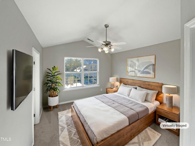 bedroom featuring ceiling fan, carpet flooring, visible vents, baseboards, and vaulted ceiling