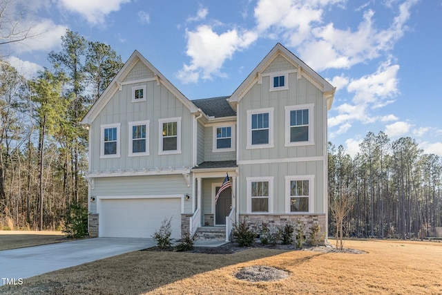 craftsman inspired home featuring board and batten siding, stone siding, a shingled roof, and concrete driveway