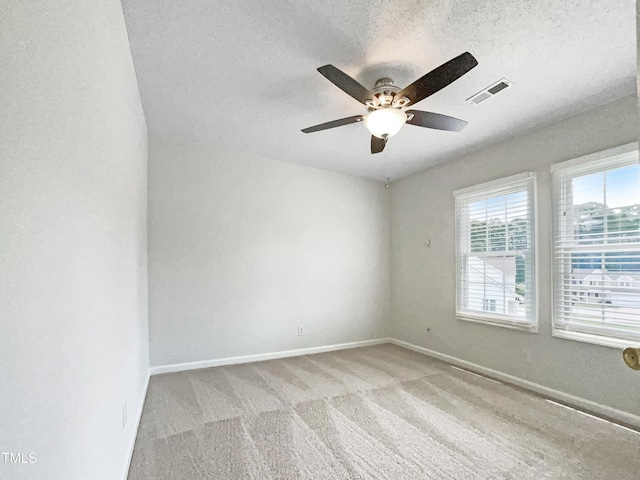 5317 Tifton Dr, Raleigh, NC 27610 - carpeted spare room with healthy amount of natural light, ceiling fan, and a textured ceiling
