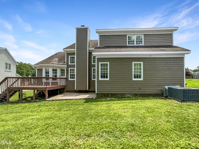 5317 Tifton Dr, Raleigh, NC 27610 - rear view of property with a chimney, a wooden deck, a yard, a patio, and roof with shingles