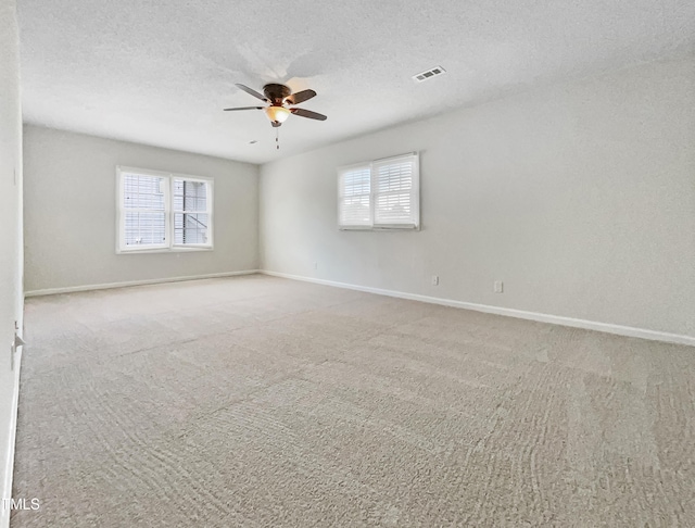 5317 Tifton Dr, Raleigh, NC 27610 - carpeted spare room featuring ceiling fan, plenty of natural light, and a textured ceiling