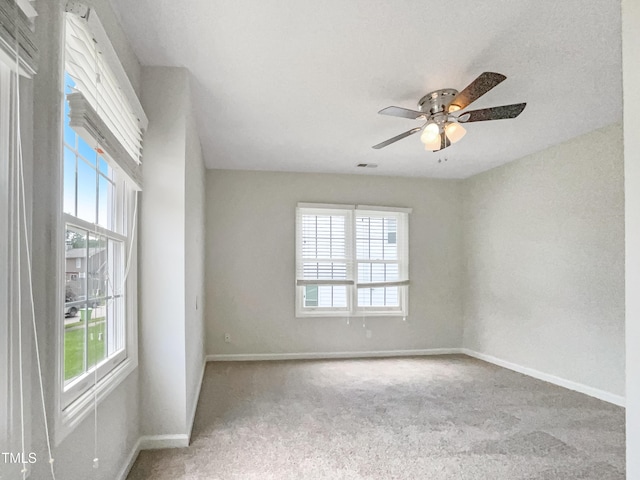 5317 Tifton Dr, Raleigh, NC 27610 - carpeted empty room with plenty of natural light and a ceiling fan
