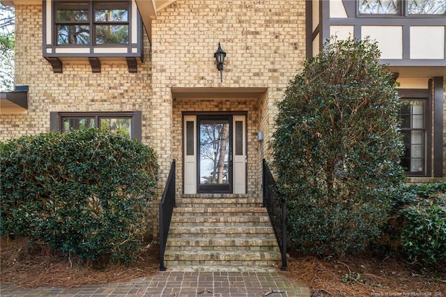 property entrance with brick siding