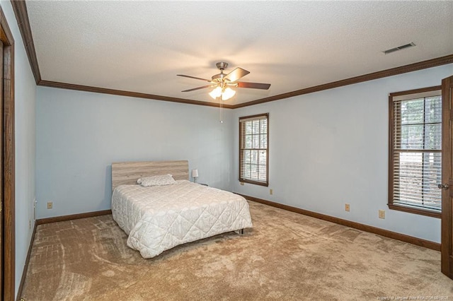 bedroom featuring carpet, a textured ceiling, visible vents, and baseboards