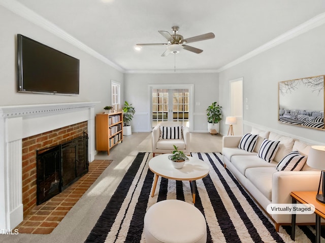 living area with ceiling fan, light carpet, baseboards, a brick fireplace, and crown molding