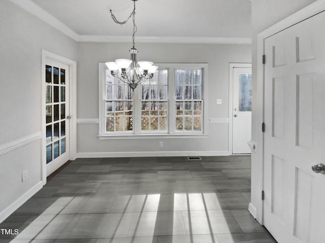 unfurnished dining area with visible vents, crown molding, a notable chandelier, and baseboards