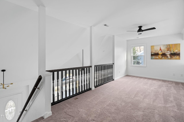 unfurnished room featuring ceiling fan, carpet flooring, visible vents, and baseboards