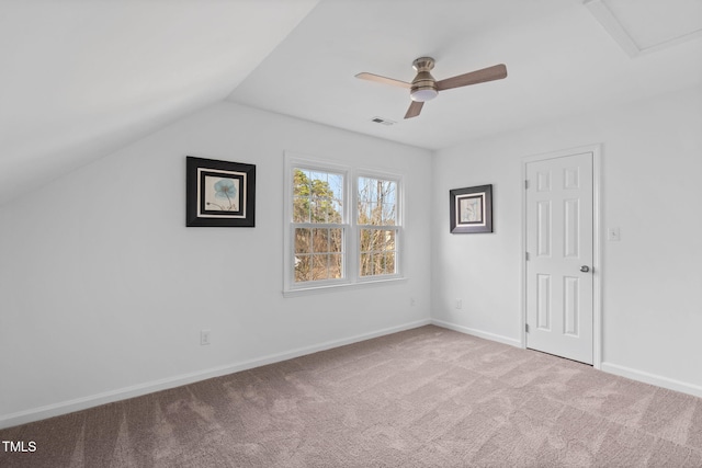 additional living space featuring lofted ceiling, ceiling fan, visible vents, baseboards, and carpet