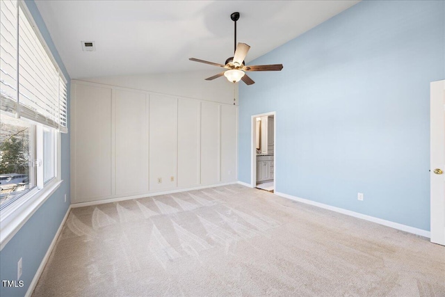 unfurnished bedroom featuring light carpet, baseboards, visible vents, and ensuite bathroom