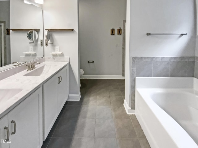 full bath with double vanity, toilet, a bath, tile patterned flooring, and a sink