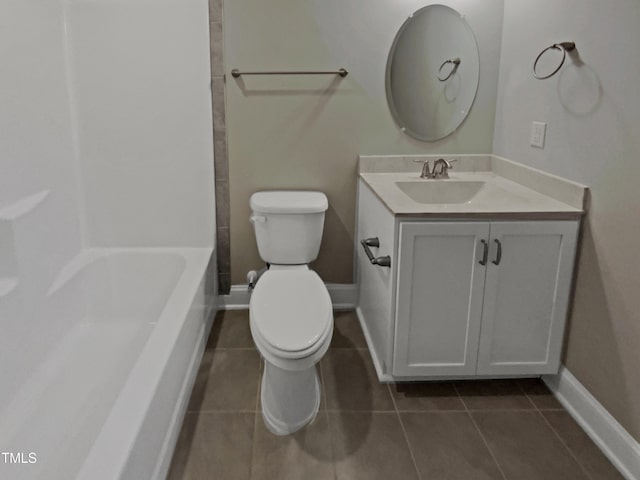 full bathroom featuring toilet, vanity, baseboards, tub / shower combination, and tile patterned floors