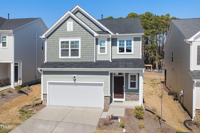 craftsman house featuring an attached garage, stone siding, and driveway