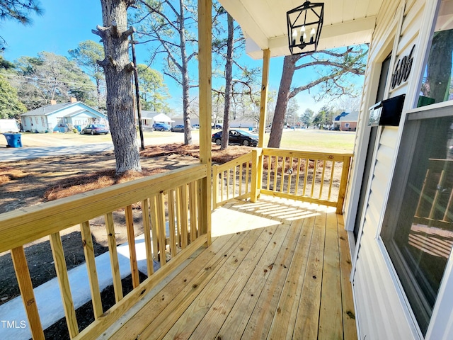 wooden terrace featuring a residential view