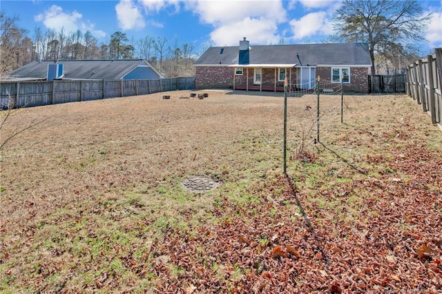 view of yard featuring a fenced backyard