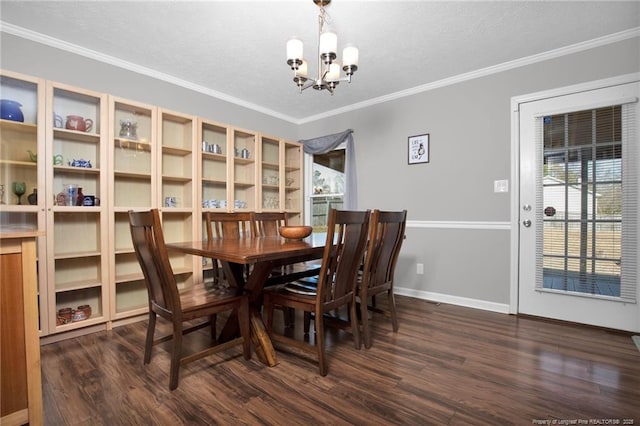 dining space with a chandelier, a textured ceiling, dark wood-style flooring, baseboards, and crown molding