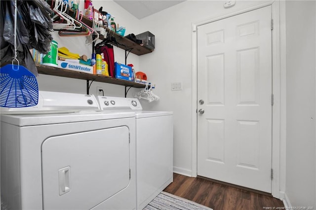 laundry room featuring dark wood-style floors, washing machine and dryer, laundry area, and baseboards