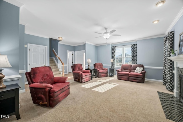 living area featuring light carpet, baseboards, stairs, crown molding, and a fireplace