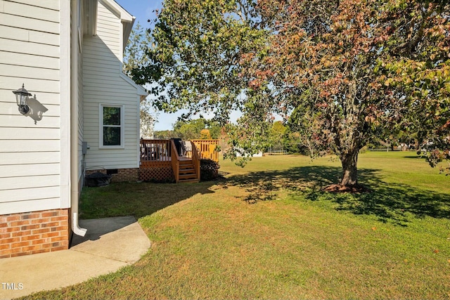 view of yard with a wooden deck