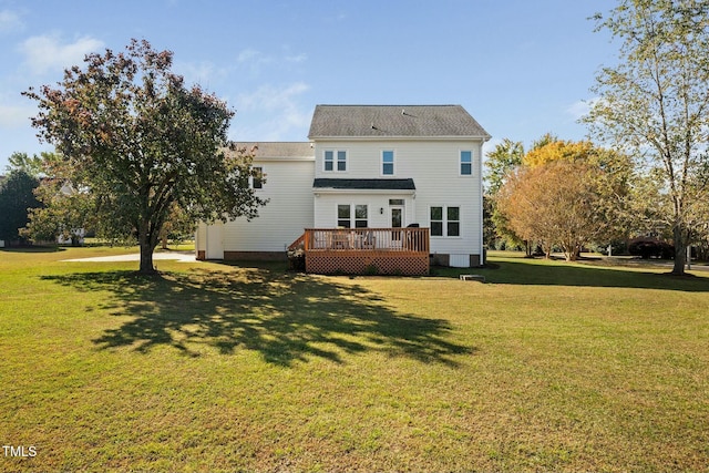 rear view of house featuring a deck and a lawn