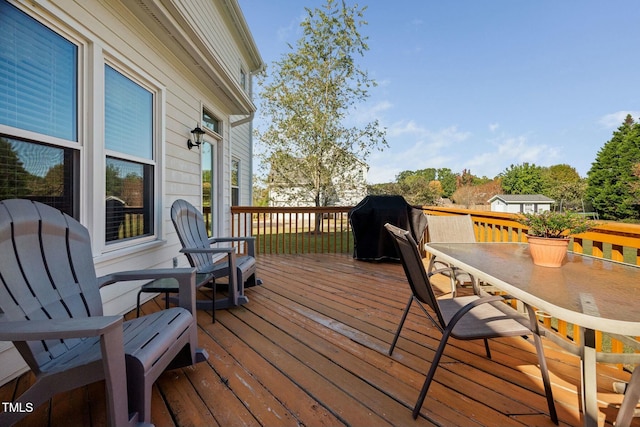 deck featuring outdoor dining area