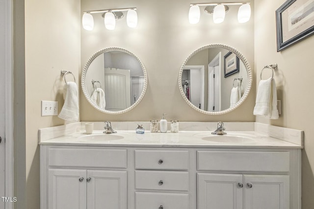 bathroom with double vanity and a sink