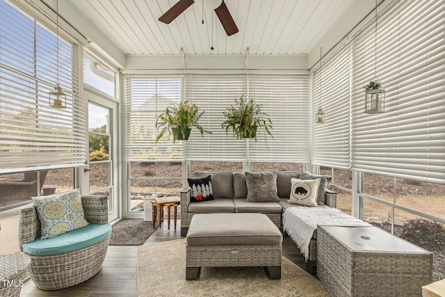 sunroom featuring wooden ceiling and ceiling fan