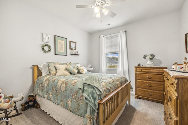 bedroom featuring carpet flooring, visible vents, and a ceiling fan