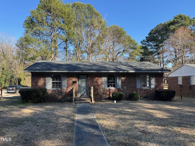 single story home with brick siding