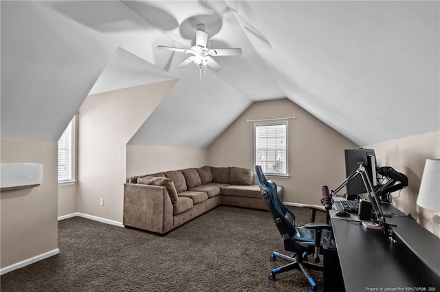 office with dark carpet, ceiling fan, baseboards, and vaulted ceiling