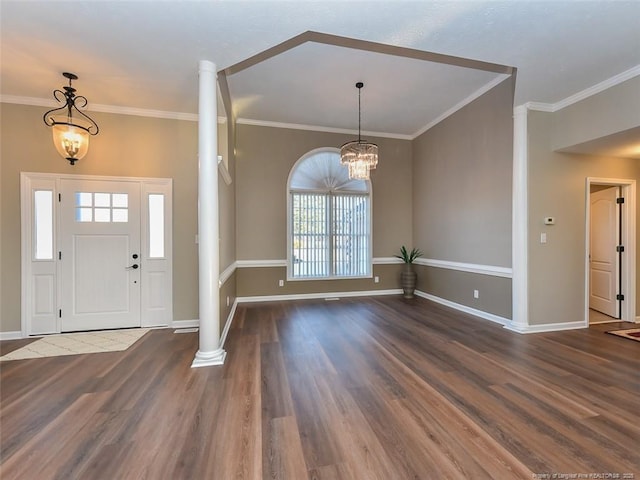 foyer featuring ornamental molding, a notable chandelier, and wood finished floors