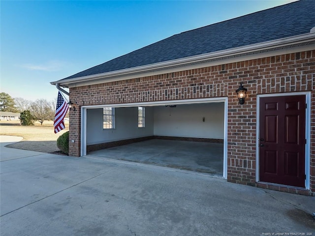 garage featuring driveway