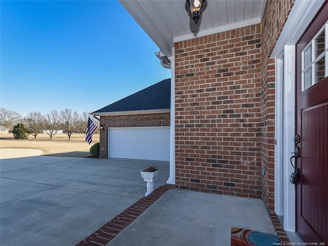 exterior space featuring driveway and an attached garage