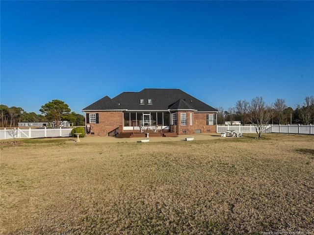 back of house with crawl space, a patio area, a fenced backyard, and a lawn