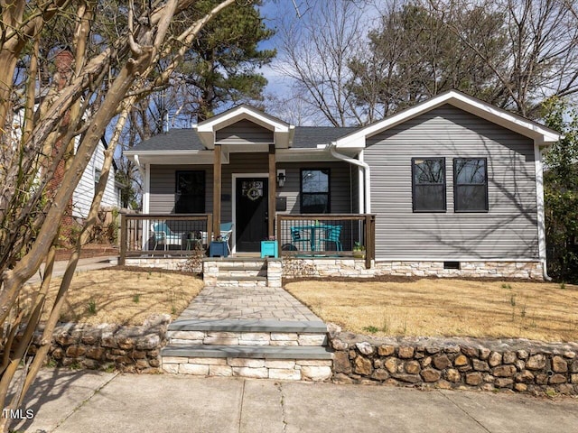 view of front of house featuring crawl space and a porch