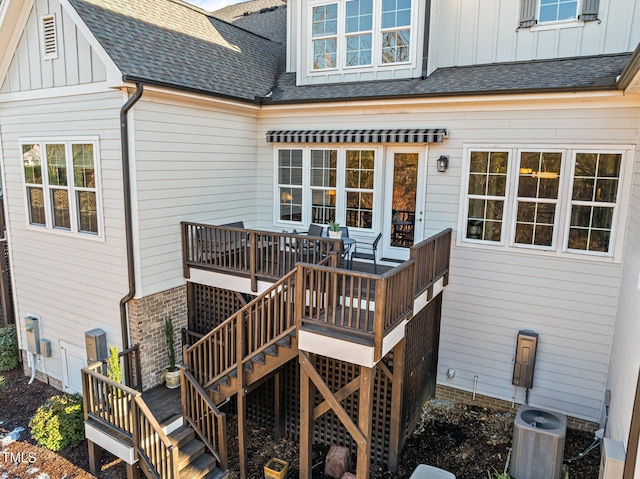 wooden deck featuring stairs and central air condition unit