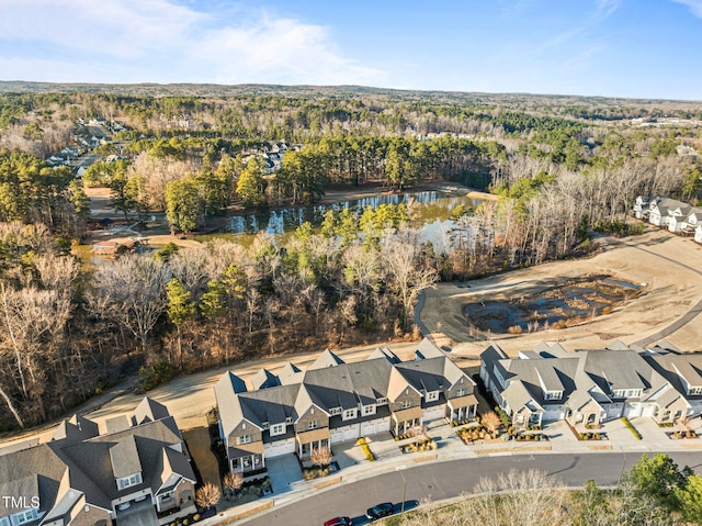 bird's eye view with a water view, a forest view, and a residential view