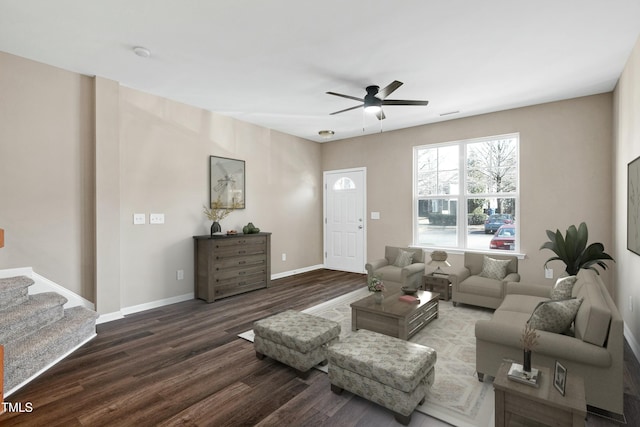 living area with ceiling fan, stairs, baseboards, and dark wood-style flooring