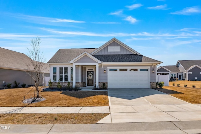 view of front of home featuring an attached garage, brick siding, driveway, a front lawn, and board and batten siding