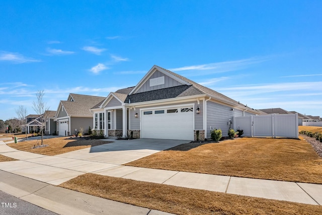 view of front facade with board and batten siding, a gate, a garage, driveway, and a front lawn