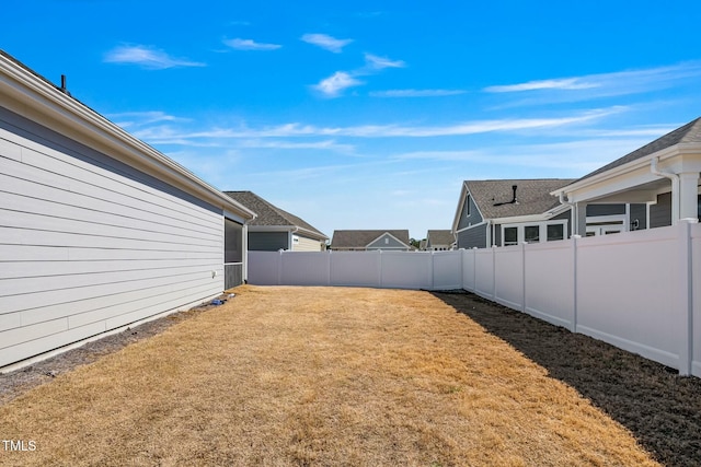 view of yard featuring a fenced backyard