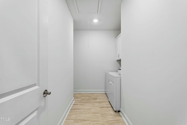 clothes washing area with recessed lighting, baseboards, independent washer and dryer, cabinet space, and attic access