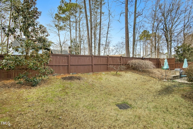 view of yard with a fenced backyard