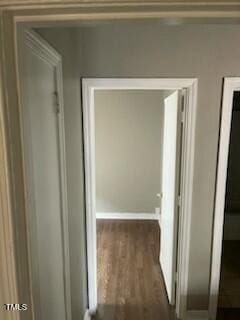 hallway featuring dark wood-style flooring