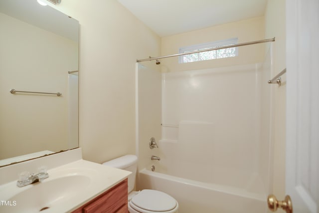 bathroom with bathing tub / shower combination, vanity, and toilet